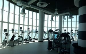 A circular windowed room with cardio fitness equipment