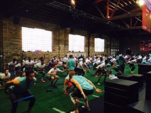 People using an indoor grass mat for a cardio workout