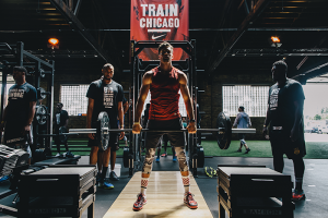 Nike's Train Chicago with a man free lifting weights