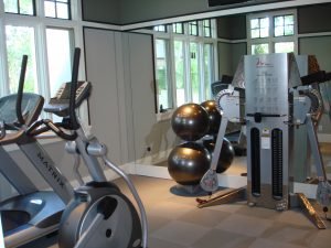 A residential fitness room with matrix equipment