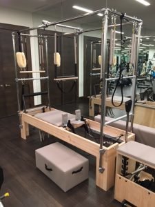 A complicated weight machine in a residential room