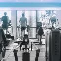 3 people walking or running on Matrix treadmills